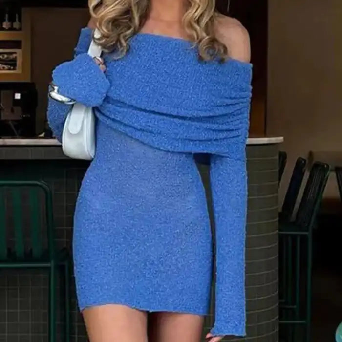 Knitted blue dress styled for evening with off-shoulder fit and matching sleeve detail.