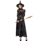 Lace witch Halloween costume with long black gown, pointed hat, and broom.