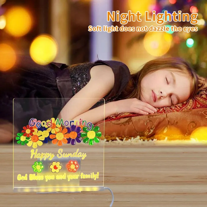 LED acrylic drawing board with colorful Sunday greeting beside a sleeping child, creating a soft kids nightlight and cheerful morning message.