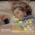 LED acrylic drawing board with glowing Merry Christmas design placed near a sleeping child, offering gentle night lighting for comfort.
