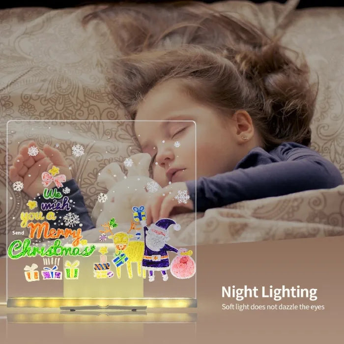 LED acrylic drawing board with glowing Merry Christmas design beside a sleeping child, offering soft night lighting that enhances holiday comfort.