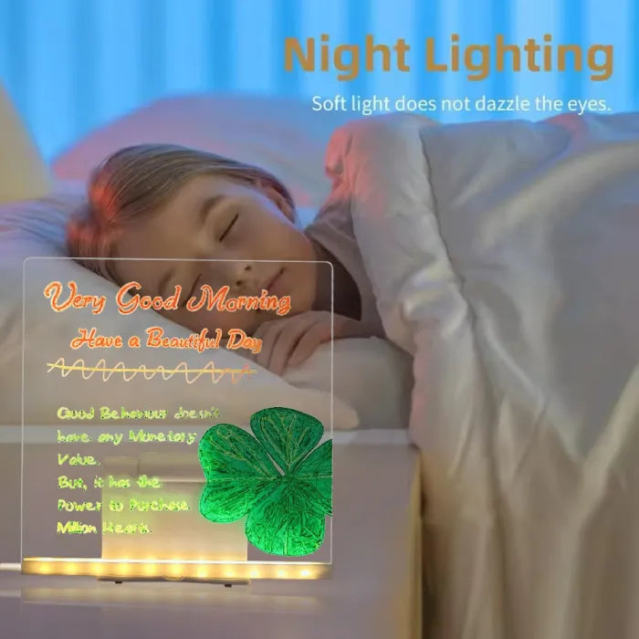LED acrylic drawing board glowing with a Good Morning message and clover design beside a child, creating a gentle inspirational nightlight.
