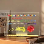 LED acrylic drawing board showing a bright inspirational morning quote with floral artwork, offering a cheerful light-up message for daily joy.