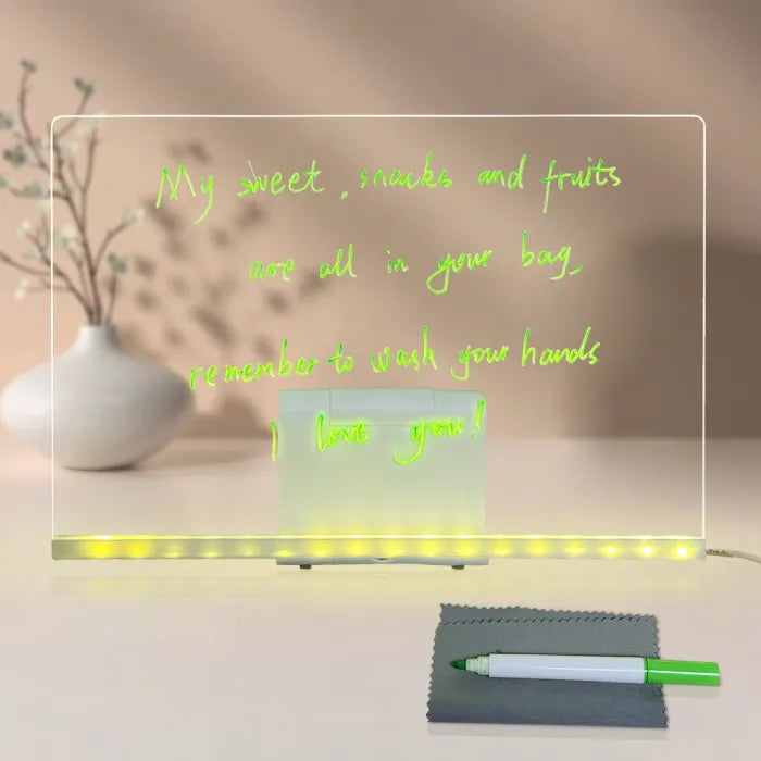 LED acrylic drawing board showing handwritten neon reminder note with soft glowing edges, offering a bright light-up message for families.