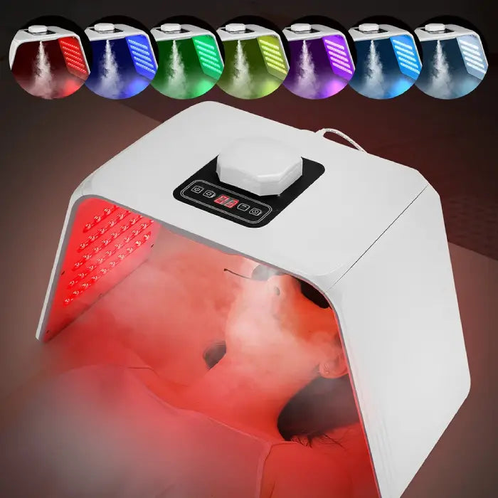 LED light therapy device in red treatment mode with mist enhancing skin repair.
