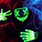 led purge mask glowing green with matching LED gloves and colorful smoke effects in a dark background.