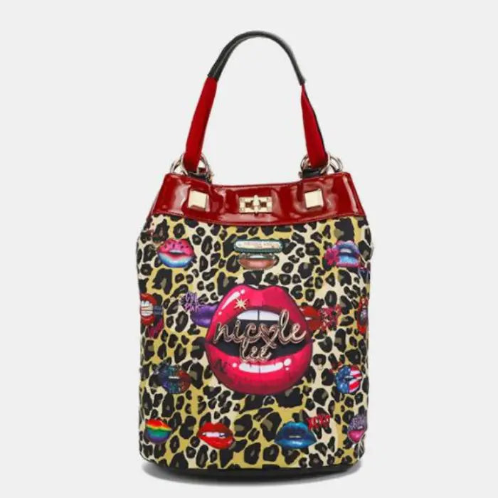 Leopard print bag with red handles and bold lip designs, featuring a stylish and colorful fashion statement.