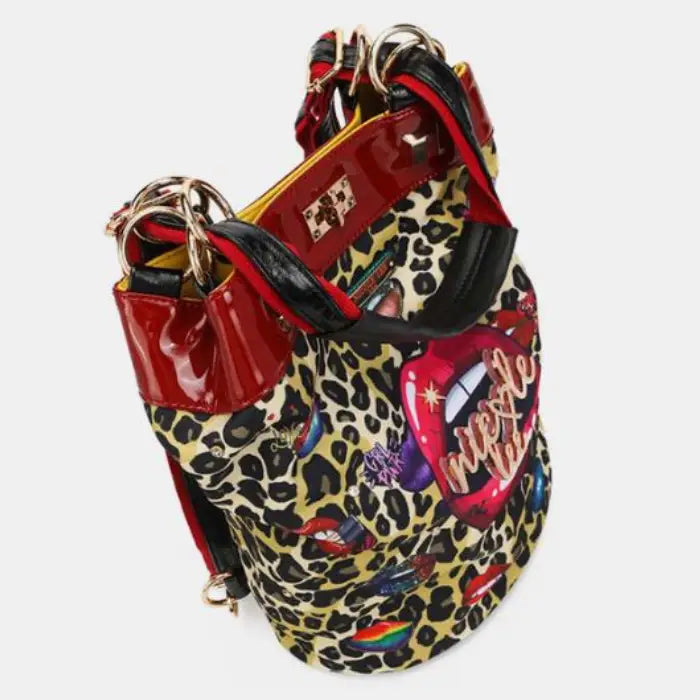 Top angle of leopard print bag highlighting red accents and vibrant lip motifs, offering a trendy look.