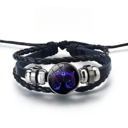 Libra zodiac glowing bracelet with scales design, braided leather, ideal for astrology-inspired fashion.