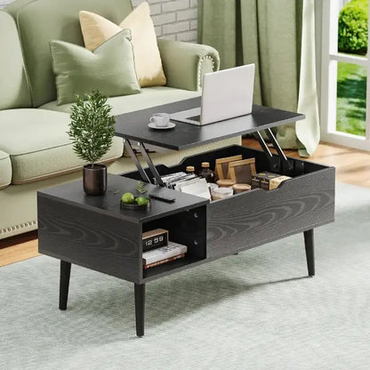 Black lift-top coffee table with storage in cozy living room, laptop and plant on top, green sofa and curtains in background