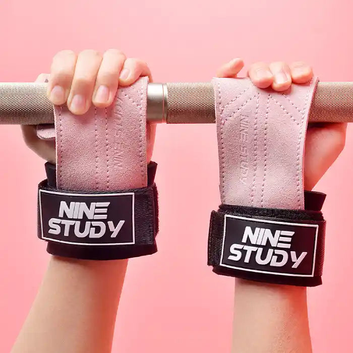 lifting straps pink padded wrist support for barbell deadlifts shown gripping a metal bar
