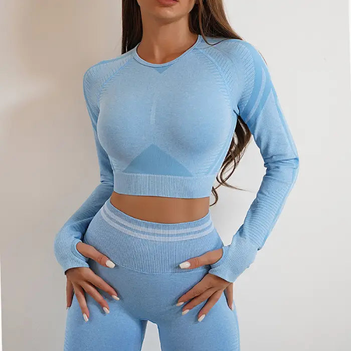 Light blue seamless activewear set with high-waisted leggings and fitted long-sleeve crop top