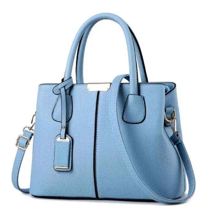 Light blue leather tote bag with gold hardware, ideal for daily use and casual outfits.