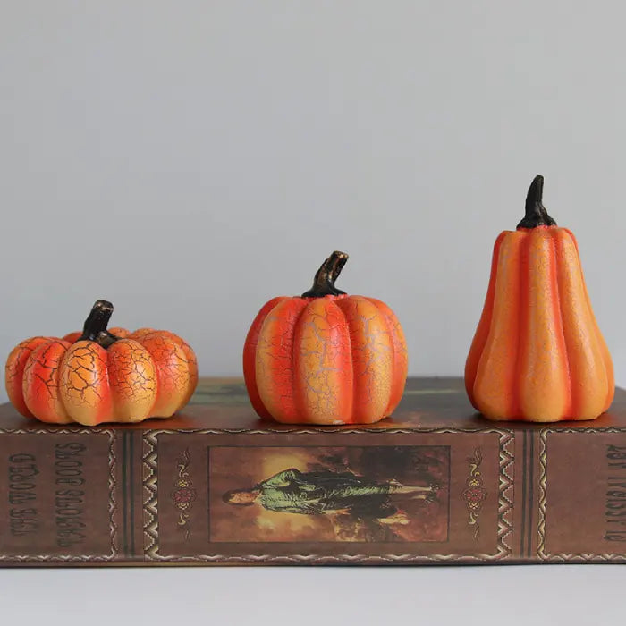 Light up pumpkin decorations on book display with crackle design, perfect for fall decorating