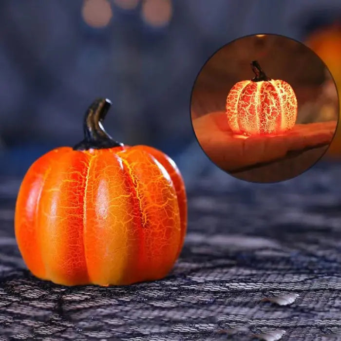 Light up pumpkin decorations with glowing handheld effect and crackled orange finish for spooky ambiance