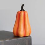 Light up pumpkin decoration shaped like gourd with soft orange crackled surface and curved stem