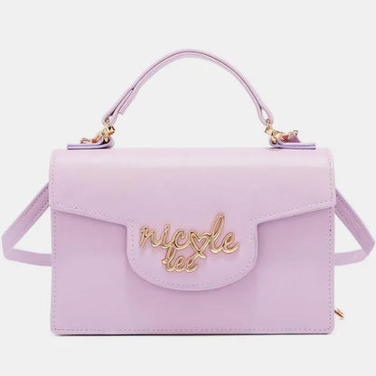 Lilac leather handbag with gold logo, top handle, flap closure, and detachable shoulder strap