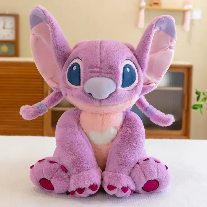 lilo and stitch Angel pink plush character toy with heart belly sitting on table
