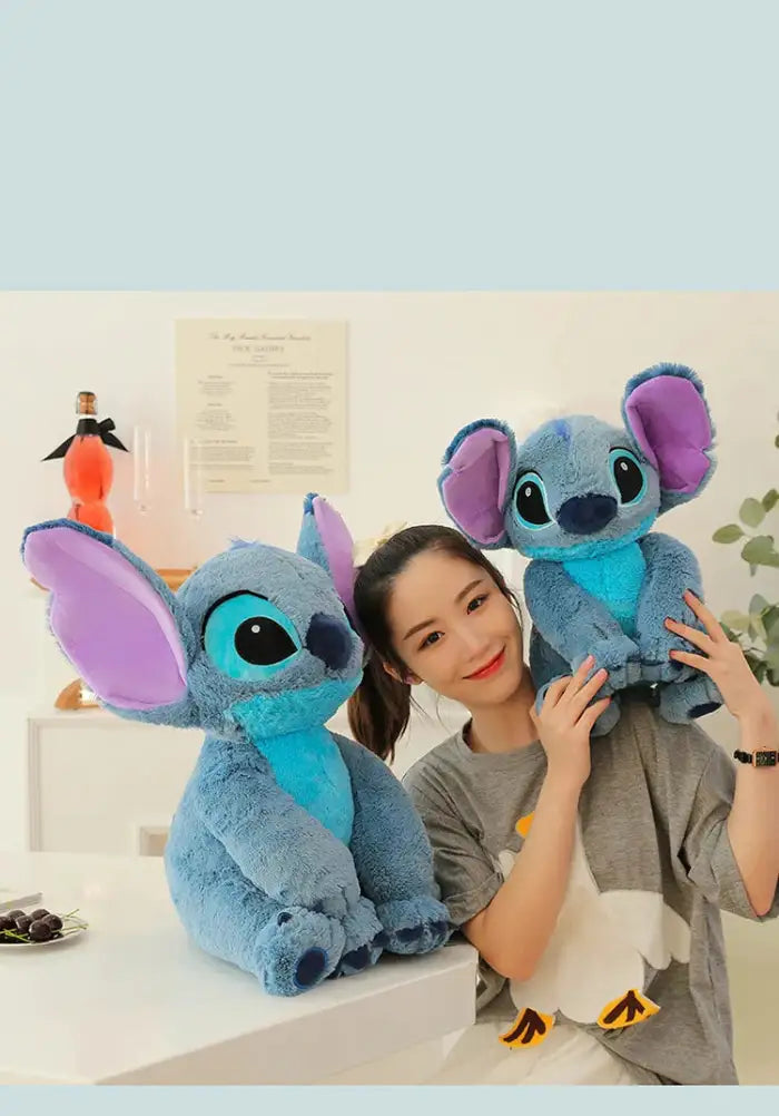 lilo and Stitch plush toys being held and posed by cheerful girl in bright room