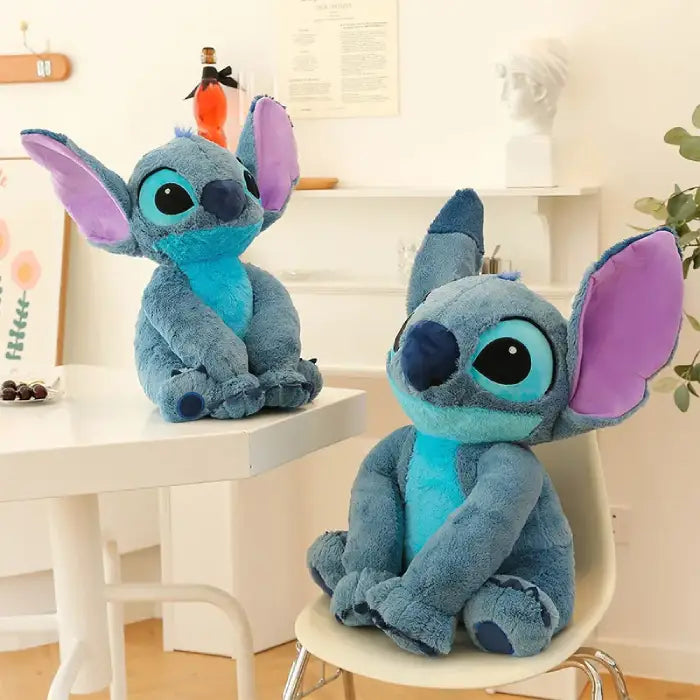 lilo and Stitch plush toys displayed on chair and table in cozy room