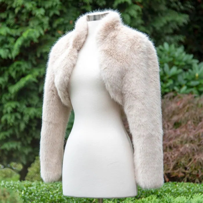 long sleeve faux fur bolero jacket in light beige on mannequin, featuring soft fluffy texture perfect for bridal looks or winter events