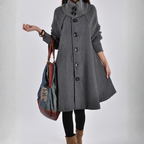 Long trench coat in grey wool with ribbed knit sleeves and button front for stylish winter layering