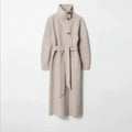 Long tweed coat women in beige shown with a high-neck tailored silhouette and belt detail, highlighting premium wool winter craftsmanship