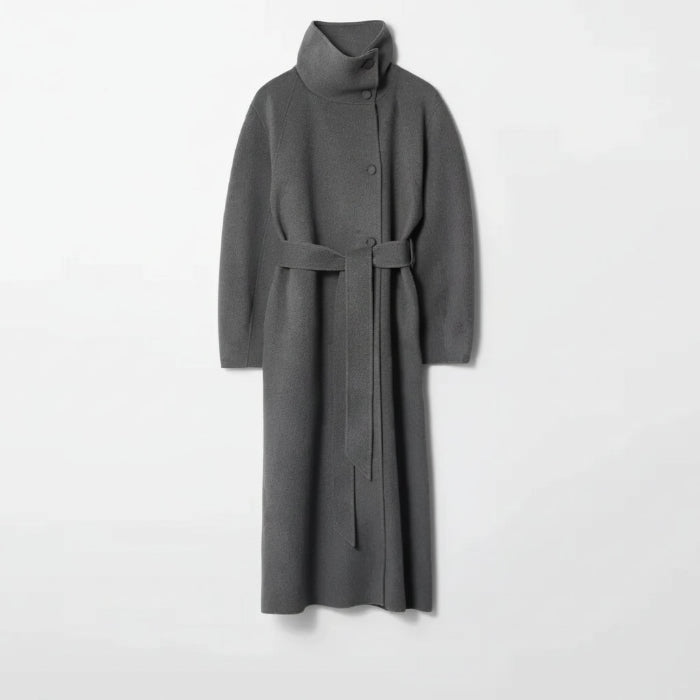 Long tweed coat women in grey with a high-neck wool structure and tie belt, creating a premium soft-textured winter outerwear look