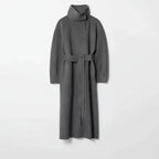 Long tweed coat women in grey with a high-neck wool structure and tie belt, creating a premium soft-textured winter outerwear look
