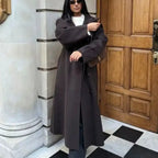 Long tweed coat women in dark brown, styled oversized with sleek winter layers for a minimalist premium look perfect for cold seasons