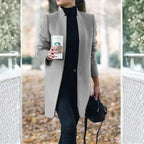 longline coat women in light gray holding coffee in an outdoor fall scene