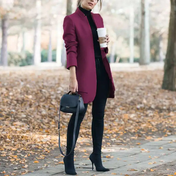 longline coat women in wine purple holding coffee outdoors in a fall setting