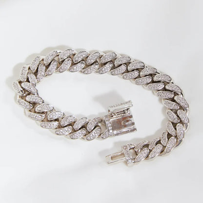 Premium Cuban link diamond bracelet arranged in circle on white backdrop highlighting luxurious pave setting details