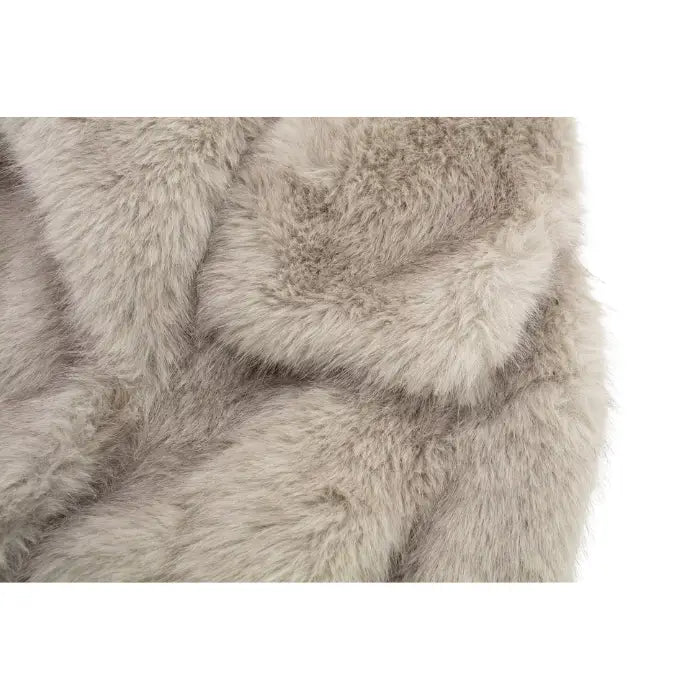Luxury faux fur coat detail highlighting plush beige collar and thick fibers, offering premium cozy texture for sophisticated outerwear