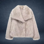 Luxury faux fur coat in beige shown on dark backdrop with wide collar and plush fibers, highlighting premium warm winter outerwear style