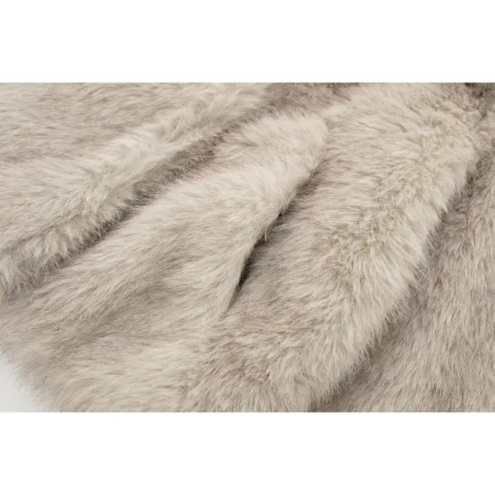 Luxury faux fur coat texture in beige with deep folds, showcasing ultra-soft premium fibers ideal for high-end winter fashion styling
