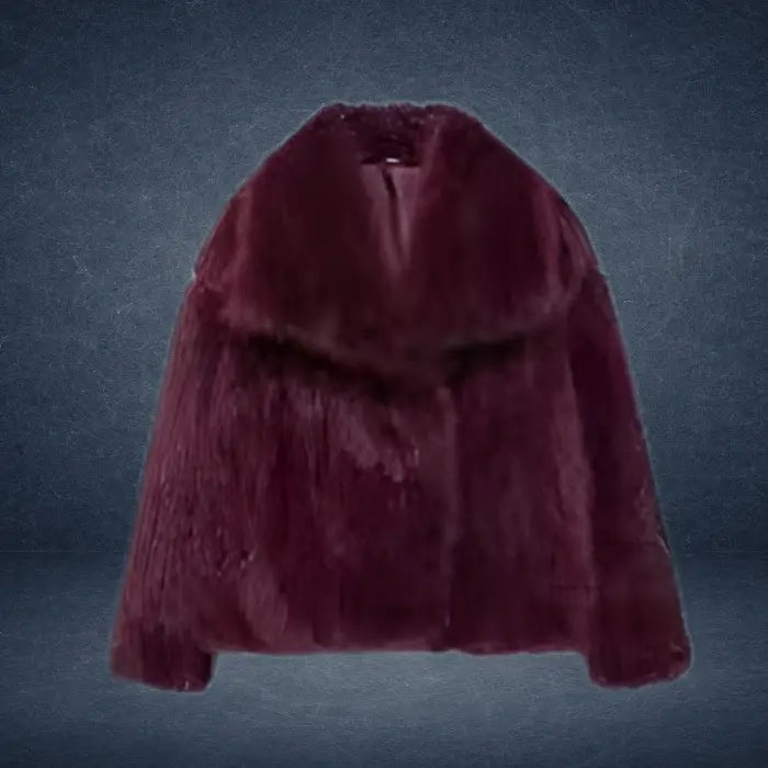 Luxury faux fur coat in deep burgundy with wide collar displayed on dark backdrop, offering refined rich texture for elegant winter wear