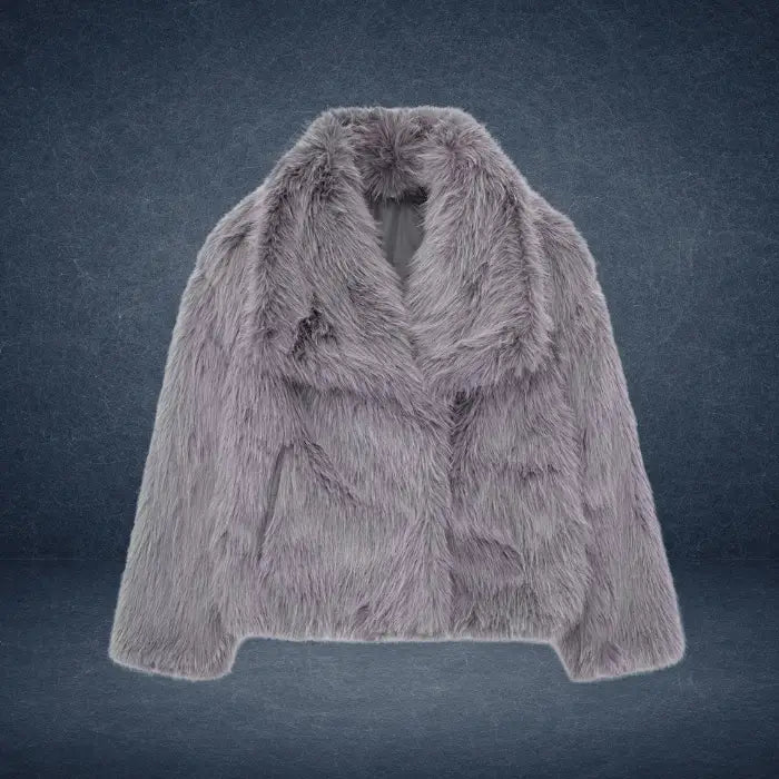 Luxury faux fur coat in soft grey against dark background, featuring thick plush texture and wide collar for elegant winter outerwear