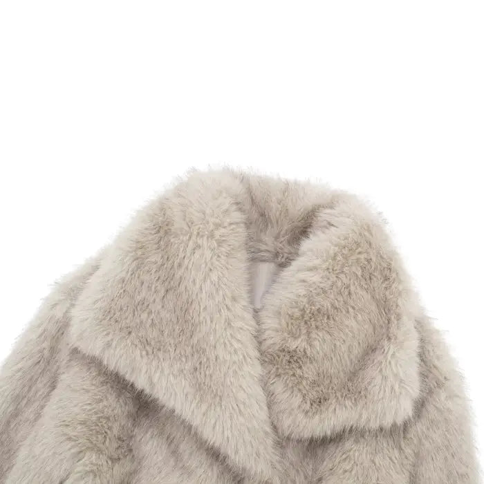Luxury faux fur coat collar in soft beige featuring dense plush fibers, highlighting refined warmth and high-end winter coat detailing
