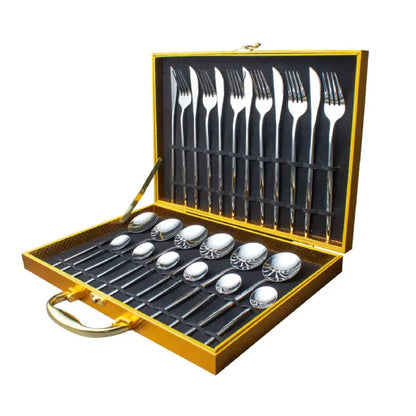 Premium silverware set with knives, forks and spoons arranged in gold presentation case with black interior