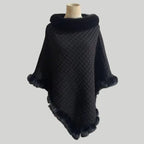 Luxury Fur-Trimmed Knit Poncho in classic black with rich fur trim and detailed knit pattern, offering a sleek and warm winter look