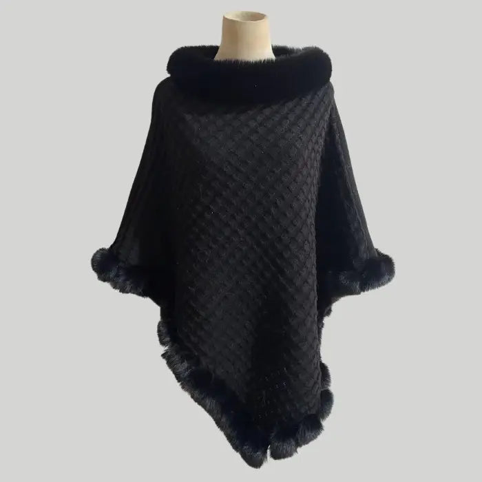Luxury Fur-Trimmed Knit Poncho in classic black with rich fur trim and detailed knit pattern, offering a sleek and warm winter look