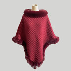 Luxury Fur-Trimmed Knit Poncho in rich burgundy with plush fur collar and trim, showcasing warm textured knit for elegant winter styling