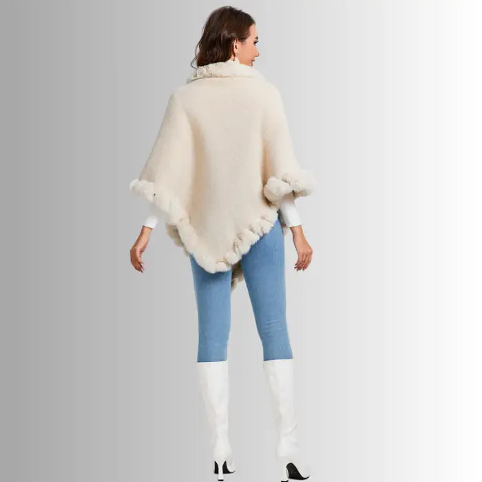 Luxury Fur-Trimmed Knit Poncho shown from back view, featuring flowing knit drape and soft fur trim for warm, stylish winter layering