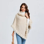 Luxury Fur-Trimmed Knit Poncho in cream displayed in full front view, highlighting plush collar and cozy textured knit for winter wear
