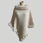Luxury Fur-Trimmed Knit Poncho in soft cream with fluffy white fur trim and textured knit design, perfect for cozy elegant winter wear