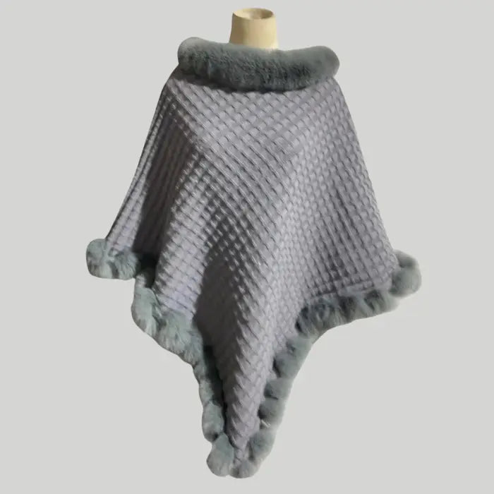 Luxury Fur-Trimmed Knit Poncho in elegant gray with soft fur trim and waffle knit texture, perfect for stylish winter layering