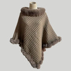 Luxury Fur-Trimmed Knit Poncho in taupe featuring soft fur edging and cozy textured knit, ideal for chic cold-weather outfits
