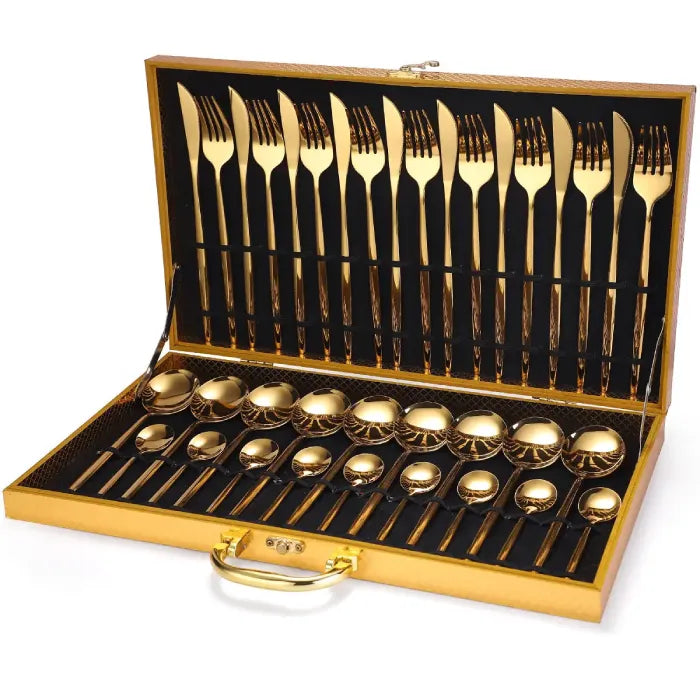 24-piece gold-plated flatware set in wooden display case with black interior lining