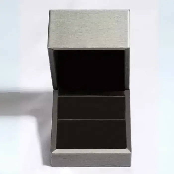 Open gray textured jewelry box with black interior lining and hinged lid shown against white background